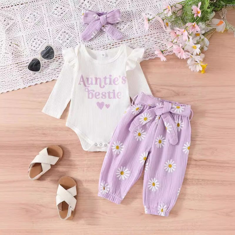 Ruffled Long-sleeve Bodysuit Paired With Matching Pants And A Bow Hair Accessory