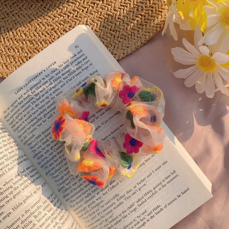 Elástico de cabelo em rede com flores bordadas
